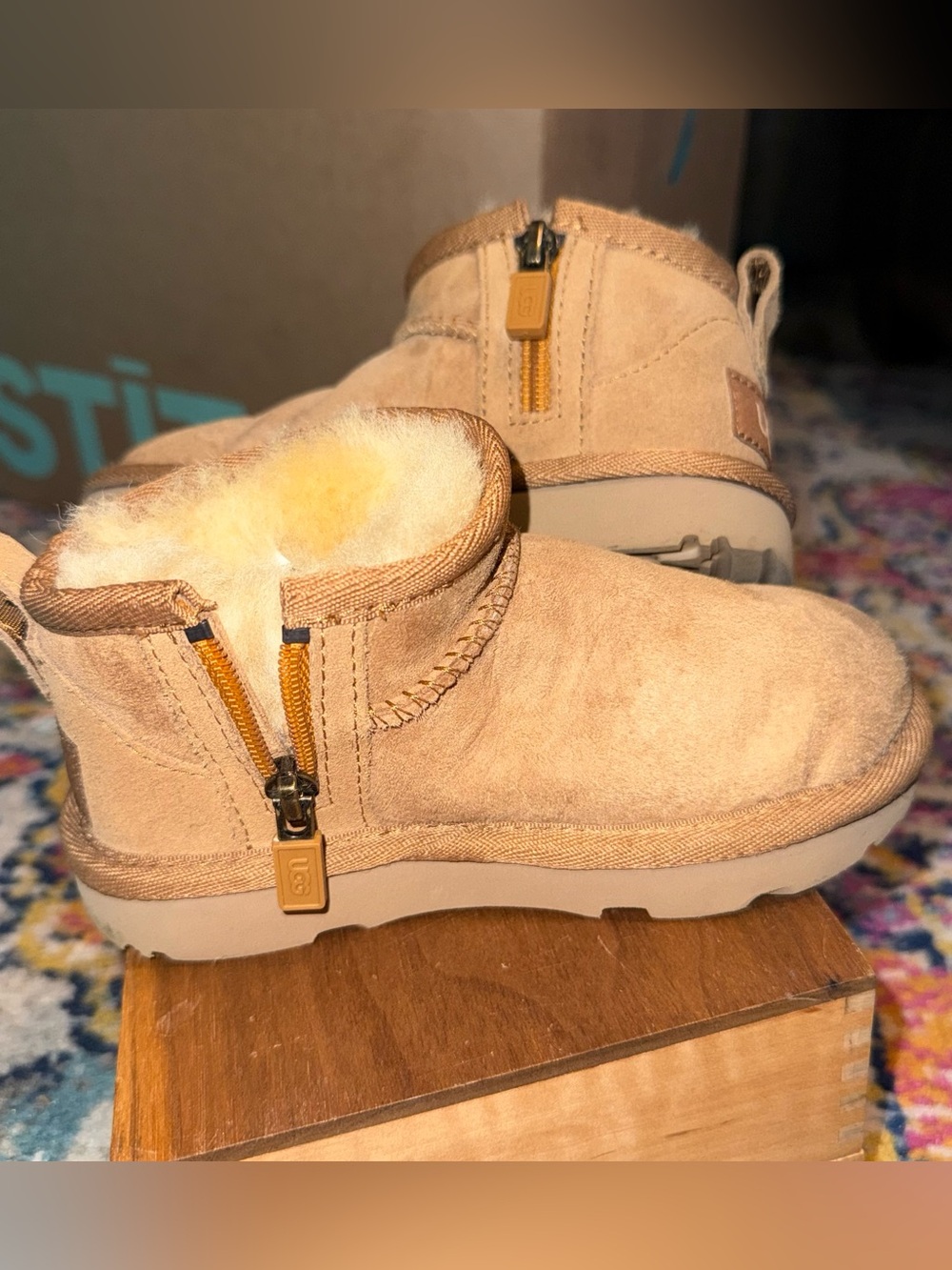 Kids UGG Mini Zip Booties in Chestnut
